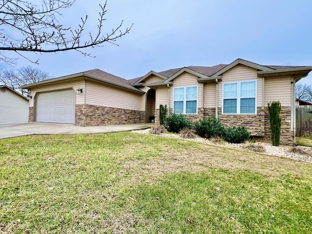 view of front of home with a garage and a front yard