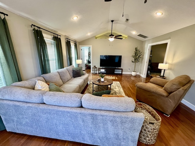 living room featuring lofted ceiling, dark hardwood / wood-style floors, and ceiling fan