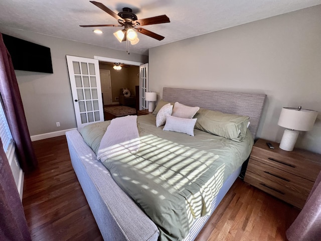 bedroom featuring wood-type flooring, french doors, and ceiling fan