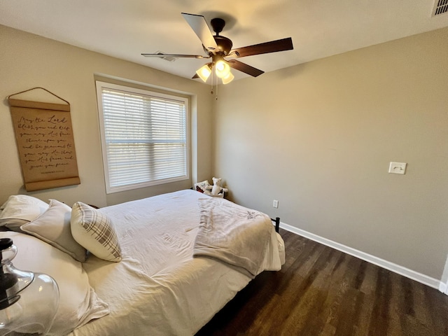 bedroom featuring dark wood-type flooring and ceiling fan