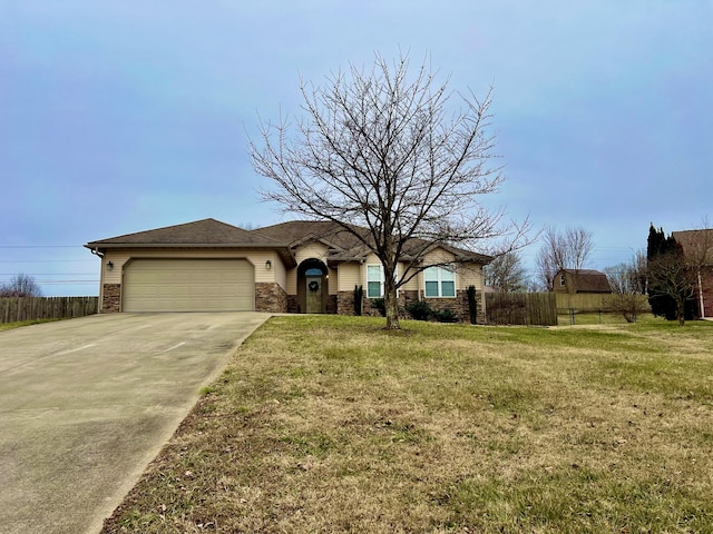 single story home with a garage and a front lawn