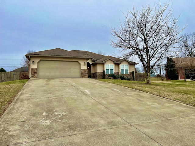 ranch-style house with a garage and a front yard