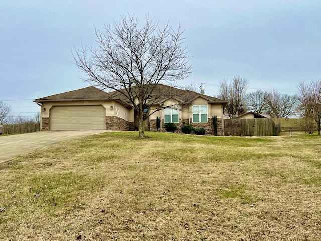 ranch-style house featuring a garage and a front lawn