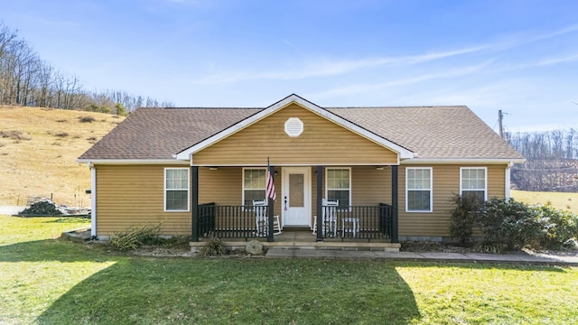 bungalow-style home featuring a porch and a front lawn