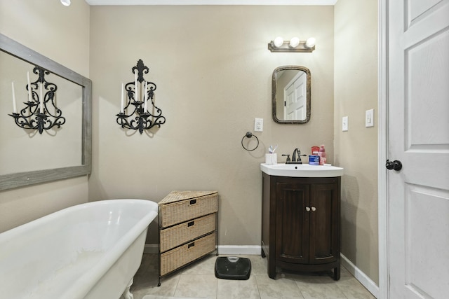 bathroom with vanity, tile patterned flooring, and a tub