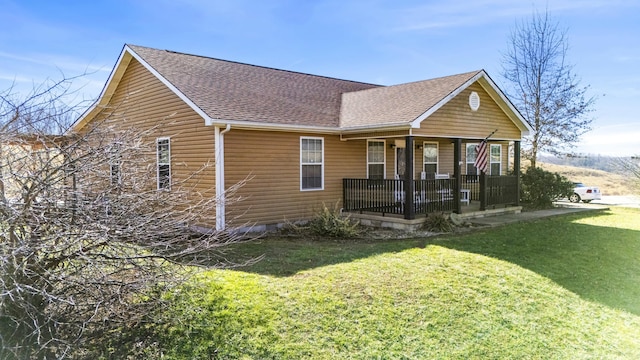 view of front of property with a porch and a front yard