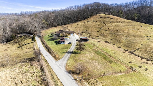 birds eye view of property with a rural view