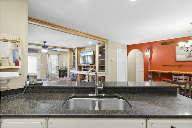 kitchen with white cabinetry and sink