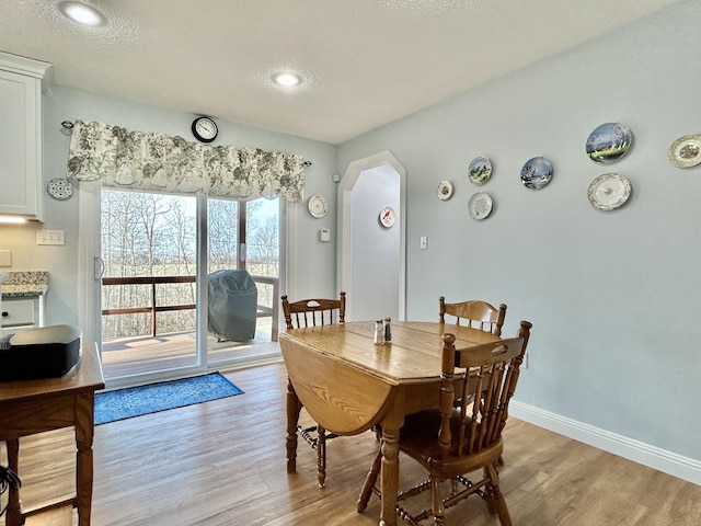 dining space featuring light hardwood / wood-style flooring