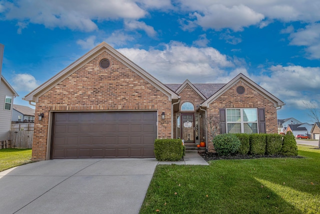 view of front of home featuring a garage and a front yard