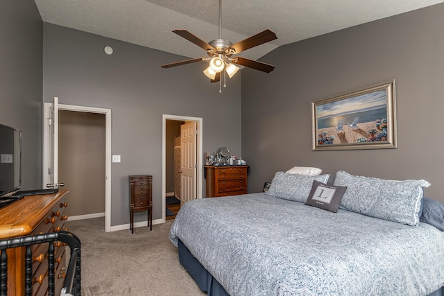 bedroom featuring ceiling fan, high vaulted ceiling, a textured ceiling, and carpet