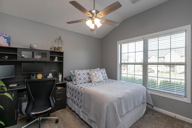 bedroom with vaulted ceiling, ceiling fan, and carpet floors