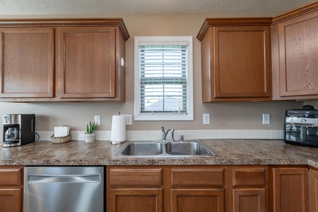 kitchen featuring dishwasher and sink