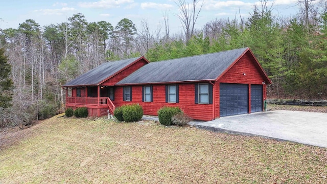 view of front of home with a garage and a front yard