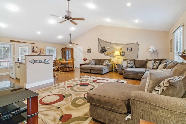 living room with vaulted ceiling and light hardwood / wood-style floors