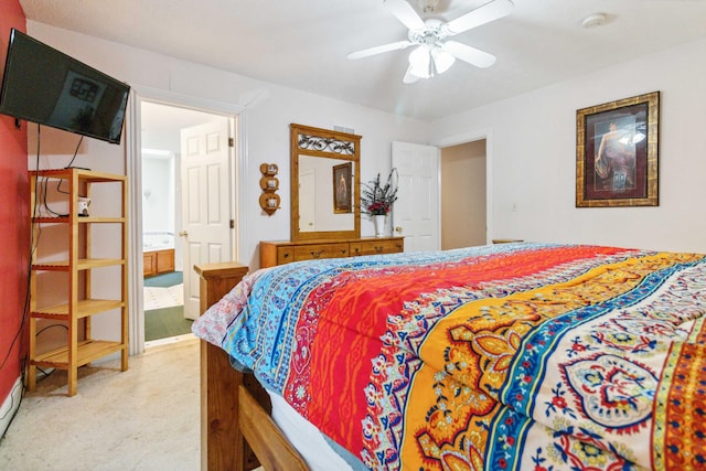 carpeted bedroom featuring ensuite bath and ceiling fan