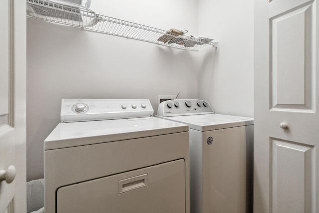 washroom with separate washer and dryer