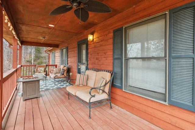 deck featuring a porch and ceiling fan