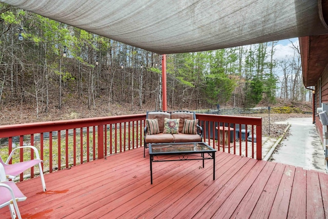 wooden terrace featuring outdoor lounge area