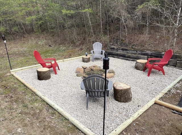 view of yard featuring an outdoor fire pit