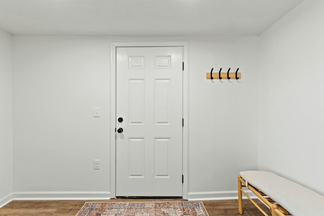 entryway with dark hardwood / wood-style flooring