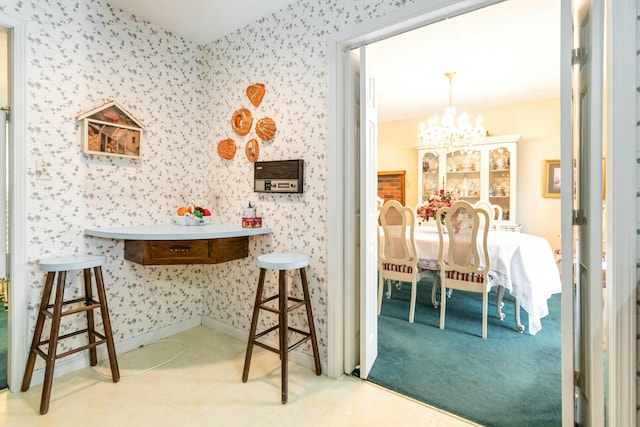 125 Thomas St, Somerset, KY 42503 - interior space with wallpapered walls, carpet floors, baseboards, and an inviting chandelier