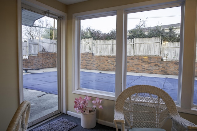 doorway featuring carpet flooring