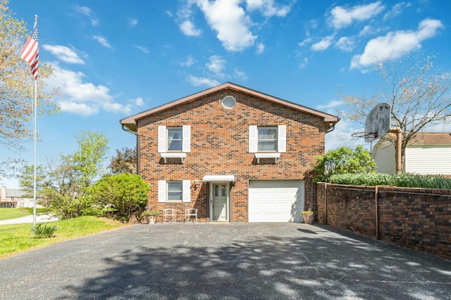 125 Thomas St, Somerset, KY 42503 - view of front of house with a garage, brick siding, aphalt driveway, and fence