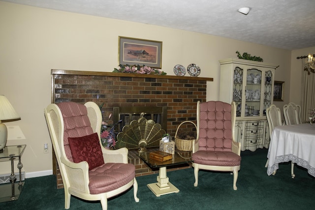 living area with a fireplace, a textured ceiling, and dark colored carpet