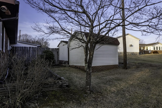 property exterior at dusk featuring a yard