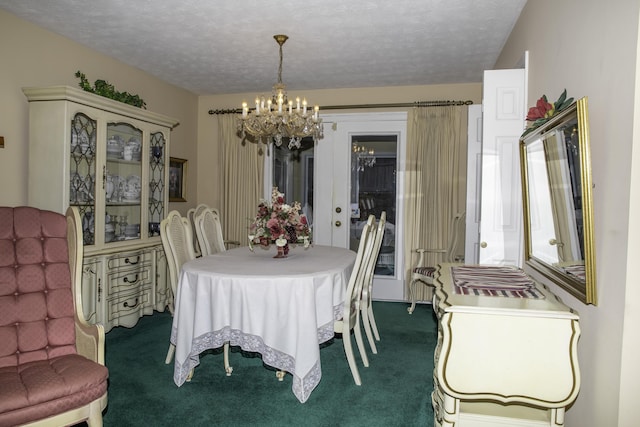 carpeted dining area with an inviting chandelier and a textured ceiling