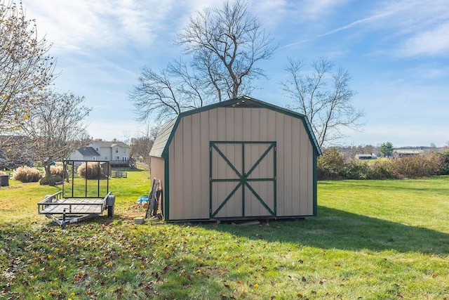 view of outbuilding with a lawn