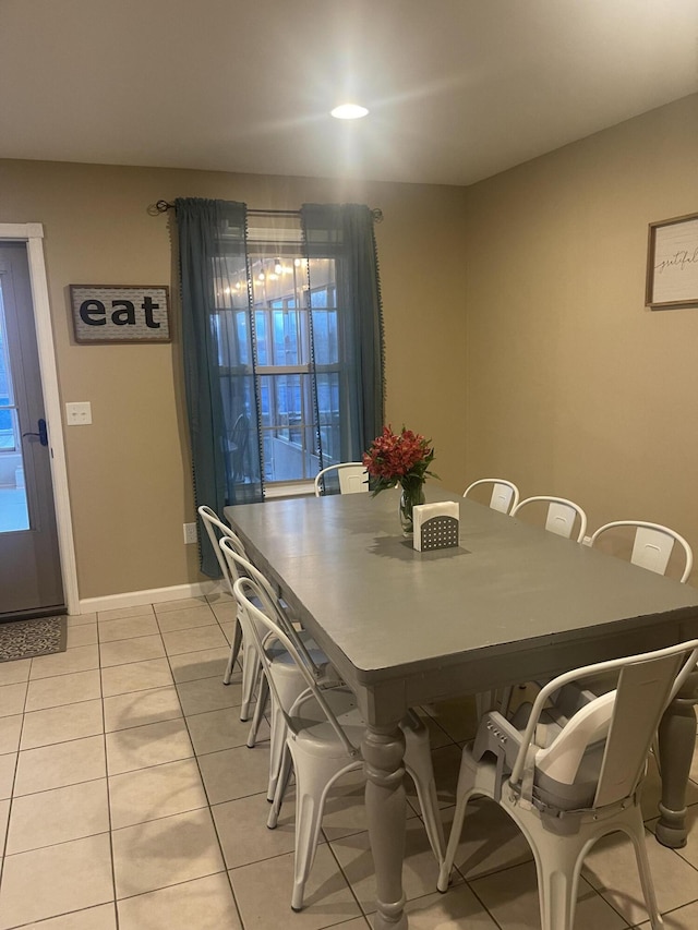 dining space with light tile patterned floors