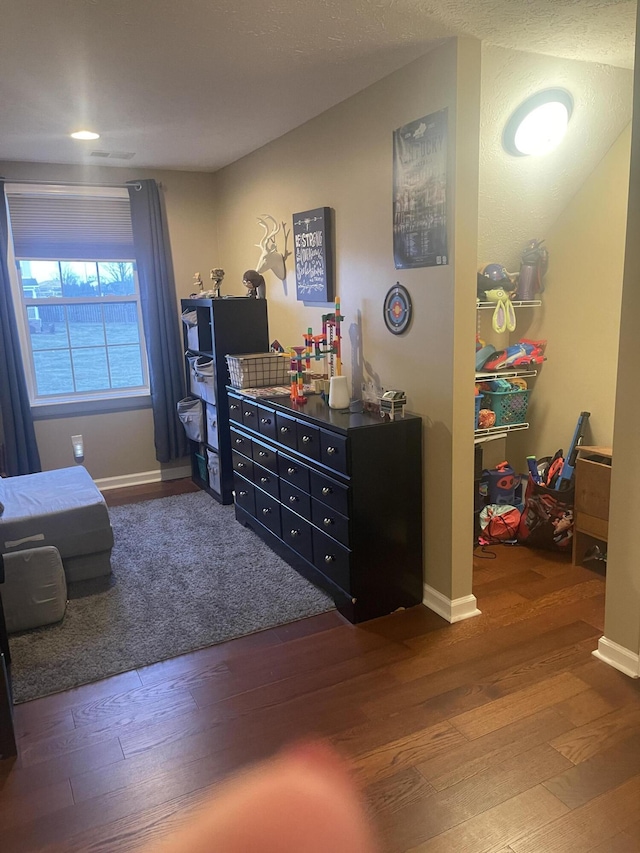 bedroom with hardwood / wood-style flooring