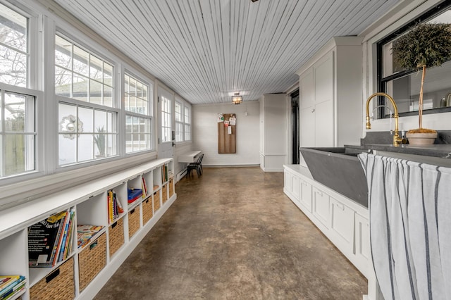 interior space featuring finished concrete floors