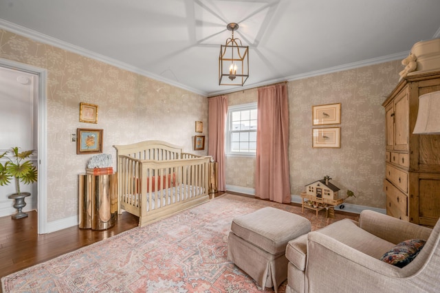 bedroom featuring wallpapered walls and baseboards