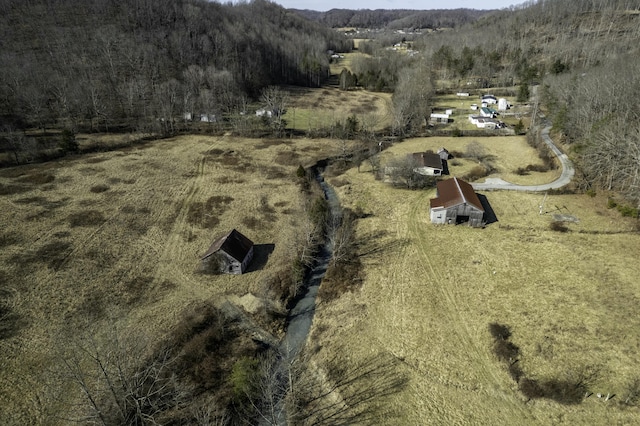 birds eye view of property with a rural view