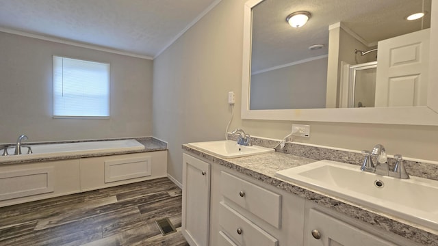 bathroom with crown molding, vanity, separate shower and tub, and hardwood / wood-style floors