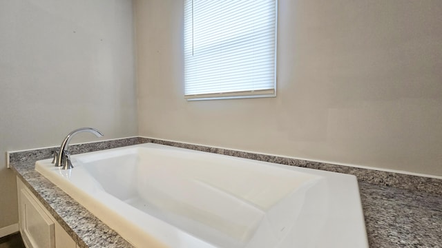 bathroom with a washtub