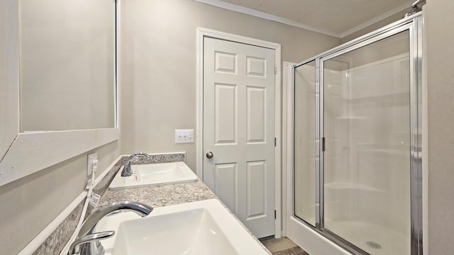 bathroom featuring vanity, ornamental molding, and walk in shower