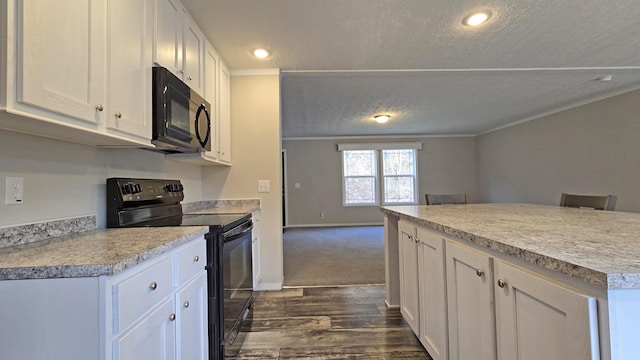 kitchen with dark wood-type flooring, white cabinets, a textured ceiling, and black appliances