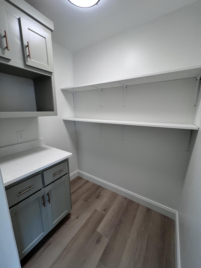 washroom with hardwood / wood-style flooring