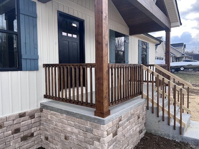 property entrance featuring board and batten siding