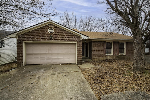 ranch-style house featuring a garage