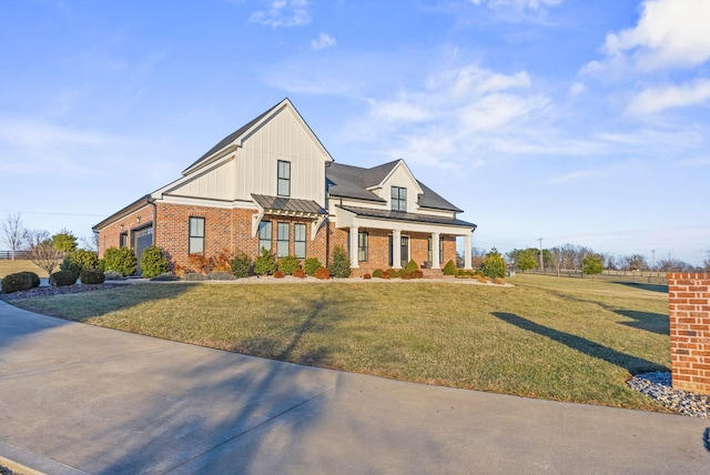 view of front of home with a garage and a front lawn