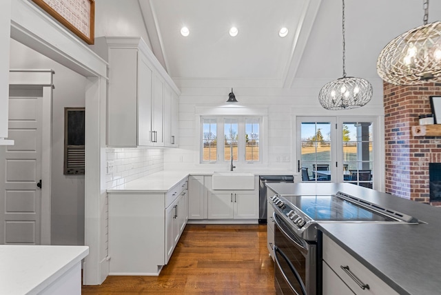 kitchen featuring white cabinetry, lofted ceiling with beams, dark hardwood / wood-style floors, stainless steel appliances, and decorative backsplash