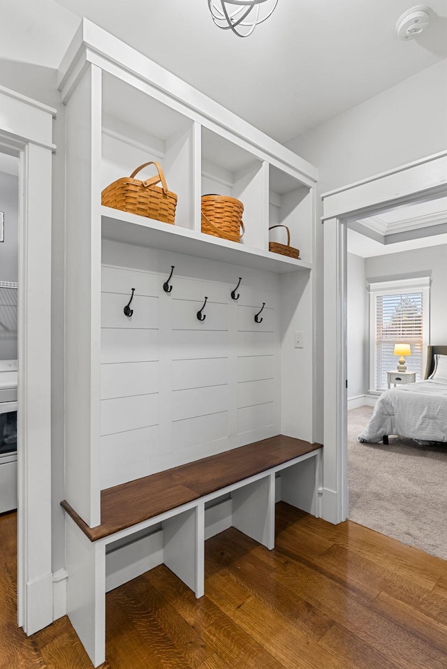 mudroom with wood-type flooring