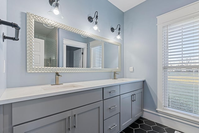 bathroom with vanity and tile patterned flooring