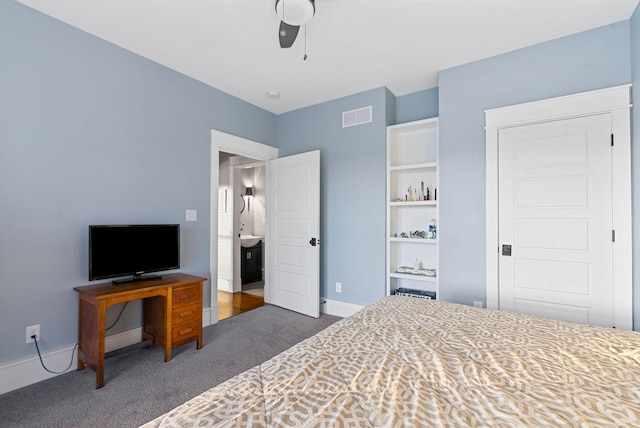 bedroom featuring ceiling fan and dark carpet