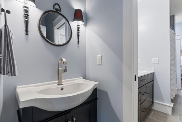 bathroom with vanity and tile patterned flooring